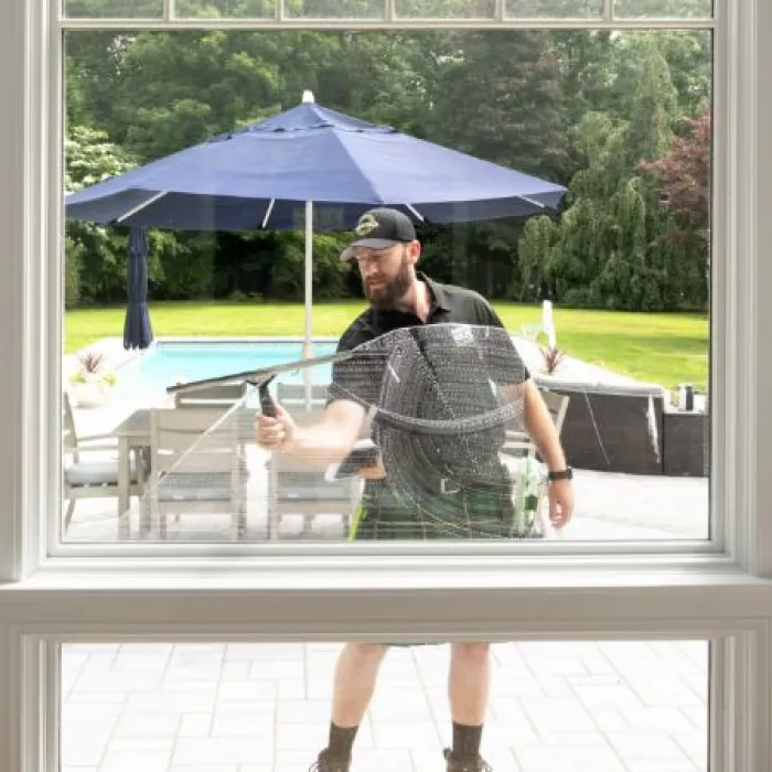 a person cleaning a window